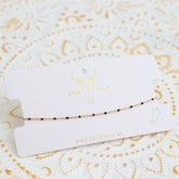 Bracelet de cheville petits points noir